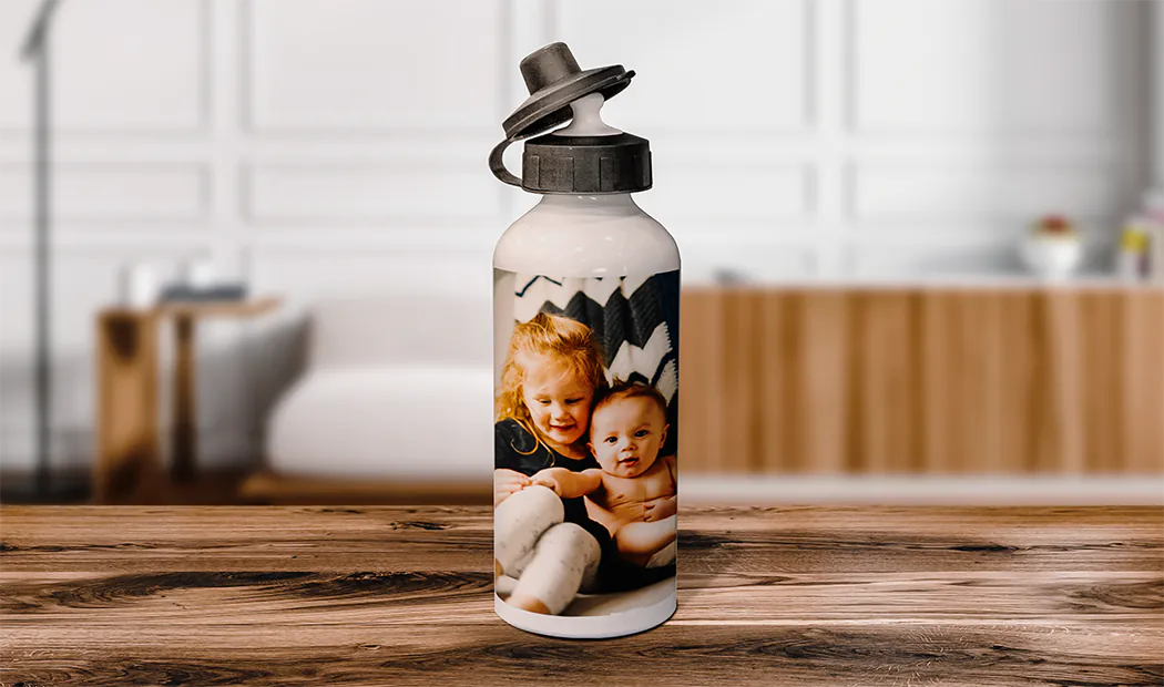Personalised water bottle; white, featuring a child's photo, black flip-top lid.  Unique gift!